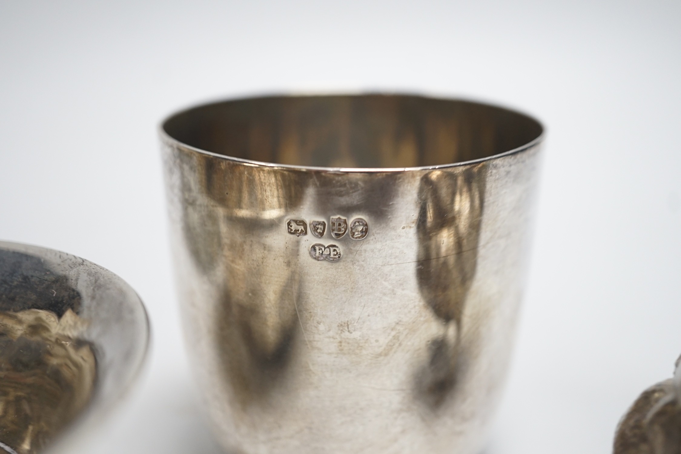 A Victorian silver tumbler cup, by Frederick Elkington, London, 1877, height 72mm, together with a silver mounted glass jar (lacking cover), a small silver bowl and an 800 white metal free-standing miniature model of a b